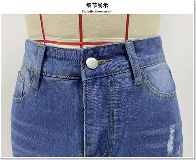 Irregular Holes In A Fringed Denim Skirt