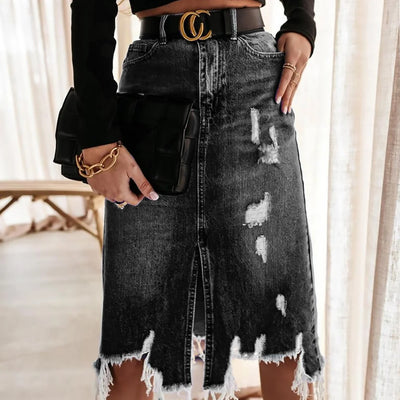 Irregular Holes In A Fringed Denim Skirt