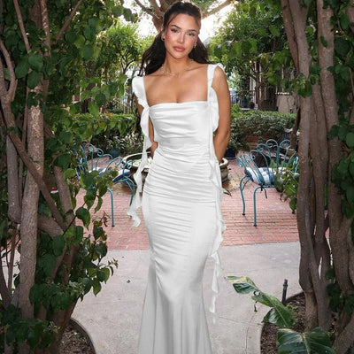 Open Back Dress With Fashionable Ruffle Edge And Ribbon Long Skirt